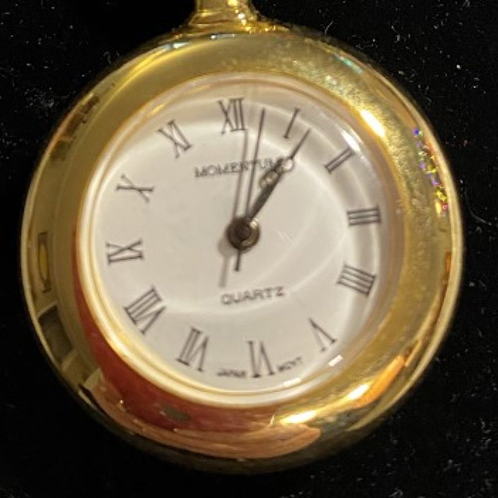 Gold tone clip on watch